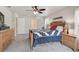 Bedroom with neutral walls, a bed with a quilt, dressers, and ceiling fan at 2834 Coolidge Ave, North Port, FL 34286