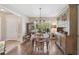 Charming dining room with hardwood floors and views to the entry and front yard at 2834 Coolidge Ave, North Port, FL 34286