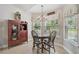 Cozy dining room featuring chandelier lighting and decorative cabinet at 2834 Coolidge Ave, North Port, FL 34286