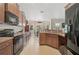 Eat-in kitchen with stainless steel appliances and tile flooring at 2834 Coolidge Ave, North Port, FL 34286