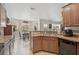 Eat-in kitchen featuring stone countertops and tile flooring at 2834 Coolidge Ave, North Port, FL 34286