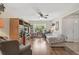 Bright living room with natural light, a ceiling fan, and hardwood floors with lots of furniture at 2834 Coolidge Ave, North Port, FL 34286