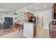 Open concept living space featuring eat-in bar and hardwood floors at 2834 Coolidge Ave, North Port, FL 34286