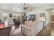 Comfortable living room featuring vaulted ceilings and hardwood flooring at 2834 Coolidge Ave, North Port, FL 34286