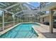 Sparkling screened-in pool with a brick patio, a great place for Gathering fun in the sun at 2834 Coolidge Ave, North Port, FL 34286