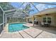 Inviting screened-in pool with brick patio, ideal for outdoor gatherings and relaxation at 2834 Coolidge Ave, North Port, FL 34286