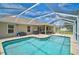 Screened-in pool and patio, a tranquil backyard oasis for relaxation and entertainment at 2834 Coolidge Ave, North Port, FL 34286