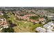 Gorgeous aerial view of a golf course community with lush landscaping and serene ponds at 301 Ravinia Cir # 301B2, Venice, FL 34292