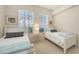 Bright bedroom with two twin beds, and natural light from a double window view at 301 Ravinia Cir # 301B2, Venice, FL 34292