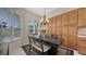 Cozy dining area with large windows, a stylish chandelier, and comfortable seating for intimate meals at 301 Ravinia Cir # 301B2, Venice, FL 34292