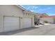 Attached garages with parking for residents in front of other similar homes in a neighborhood at 301 Ravinia Cir # 301B2, Venice, FL 34292