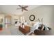 Spacious living area with neutral tones, a ceiling fan, and comfortable seating creating an inviting space at 301 Ravinia Cir # 301B2, Venice, FL 34292