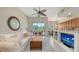 Inviting living room featuring comfortable seating, stylish decor, and sliding glass doors to outdoor space at 301 Ravinia Cir # 301B2, Venice, FL 34292