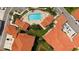 Overhead shot of sparkling community pool area with surrounding lounge chairs at 301 Ravinia Cir # 301B2, Venice, FL 34292