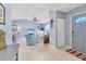 Welcoming foyer features tile flooring and leads into the spacious living area at 3181 E Village Dr, Venice, FL 34293