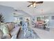 Open-concept layout seamlessly connects the living room, dining area, and kitchen at 3181 E Village Dr, Venice, FL 34293
