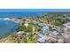 Waterfront community featuring manicured lawns, lush tropical landscaping, boat docks, and stunning bay views at 320 O Day, Englewood, FL 34223