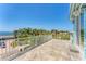 Expansive balcony with tile flooring, offering stunning views of the waterfront and surrounding landscape at 320 O Day, Englewood, FL 34223