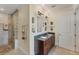 Bathroom featuring double vanity, granite countertops, glass block shower, and tile flooring at 320 O Day, Englewood, FL 34223