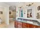 Elegant bathroom featuring a double vanity, granite countertops, and a soaking tub at 320 O Day, Englewood, FL 34223