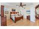 Comfortable bedroom with wood furniture, ceiling fan, and natural light at 320 O Day, Englewood, FL 34223
