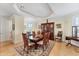 Elegant dining room with hardwood floors, a large dining table, and traditional china cabinet at 320 O Day, Englewood, FL 34223