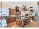 Well-lit kitchen featuring a large island, custom cabinetry, and stainless steel appliances with dining at 320 O Day, Englewood, FL 34223