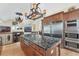 Open kitchen features a large island, stainless steel appliances, and custom cabinetry at 320 O Day, Englewood, FL 34223
