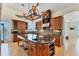 Open kitchen featuring custom cabinets, a large center island, and state-of-the-art appliances with eat in dining at 320 O Day, Englewood, FL 34223