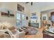 Sitting area with hardwood flooring, french doors, art, and comfortable furniture at 320 O Day, Englewood, FL 34223