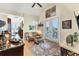 Bright sitting area with hardwood floors, stylish decor, and french doors to balcony at 320 O Day, Englewood, FL 34223