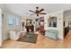 Cozy living room features plantation shutters, hardwood floors, and comfortable seating at 320 O Day, Englewood, FL 34223