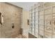 Stylish shower with glass block partition and neutral tile at 320 O Day, Englewood, FL 34223