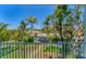 Scenic view from the balcony overlooking lush landscaping and a waterway at 320 O Day, Englewood, FL 34223
