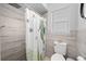 Updated bathroom with a rain shower head and seahorse shower curtain at 3355 Roslyn Rd, Venice, FL 34293