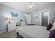 Light, airy bedroom featuring modern gray flooring, white furniture, and soft blue walls, offering a serene atmosphere at 3355 Roslyn Rd, Venice, FL 34293