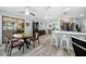 Open-concept dining area adjacent to the kitchen featuring a sliding glass door to the patio at 3355 Roslyn Rd, Venice, FL 34293