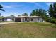 Charming single-story home features a well-maintained lawn, neutral paint, and an attached two-car garage at 3355 Roslyn Rd, Venice, FL 34293