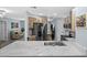 Well-appointed kitchen featuring stainless steel appliances, stone countertops, and light wood cabinetry at 3355 Roslyn Rd, Venice, FL 34293