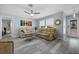 Inviting living room boasts light gray floors, neutral walls, and comfortable seating area near the entry at 3355 Roslyn Rd, Venice, FL 34293