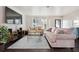 Bright living room with stylish furniture, hardwood floors, large windows, and a spacious layout at 348 Dorchester Dr, Venice, FL 34293