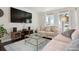 Inviting living room with modern decor, plush seating, large windows, and stylish furniture at 348 Dorchester Dr, Venice, FL 34293