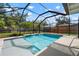 Sparkling swimming pool in a screened enclosure with a patio at 348 Dorchester Dr, Venice, FL 34293