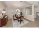 Formal dining area featuring a chandelier and neutral decor at 353 Marsh Creek Rd, Venice, FL 34292