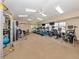 Bright gym with treadmills, exercise bikes, weight machines, and multiple ceiling fans at 353 Marsh Creek Rd, Venice, FL 34292