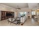 Spacious living room with tile flooring and large entertainment center at 353 Marsh Creek Rd, Venice, FL 34292