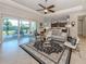 Bright living room opens to screened patio and the adjacent kitchen at 353 Marsh Creek Rd, Venice, FL 34292