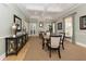 Light filled community lounge area with coffered ceilings, stylish decor, and neutral color palette at 353 Marsh Creek Rd, Venice, FL 34292