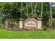 Welcome to Sawgrass! Community sign with lush landscaping and iron fencing at 353 Marsh Creek Rd, Venice, FL 34292