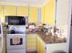 Practical kitchen area featuring good counter space and efficient appliances at 358 Longwood Dr, Venice, FL 34285